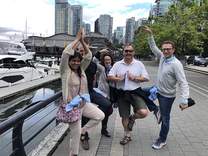 colleagues doing an outdoor wild goose chase team building activity after covid 19
